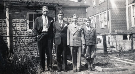 Andrew Clausen, son of James M. Clausen, poses with his 3 boys Andy, Richie, and Bobby in a New York City burrough